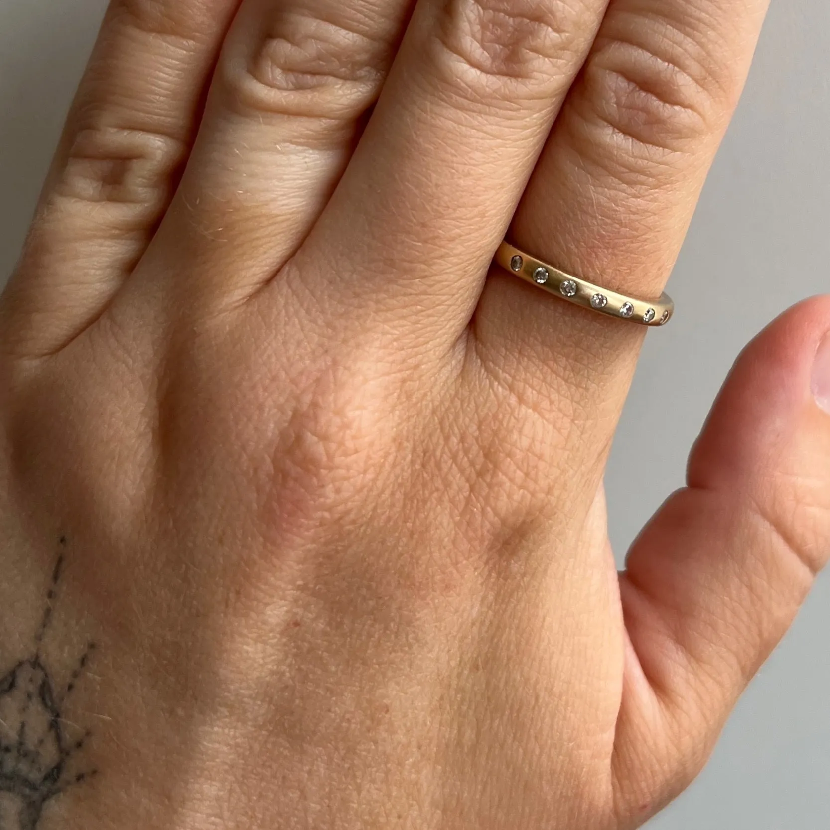 P R E - L O V E D // lucky stars / 10k yellow gold and diamond etoile flush set band / size 7